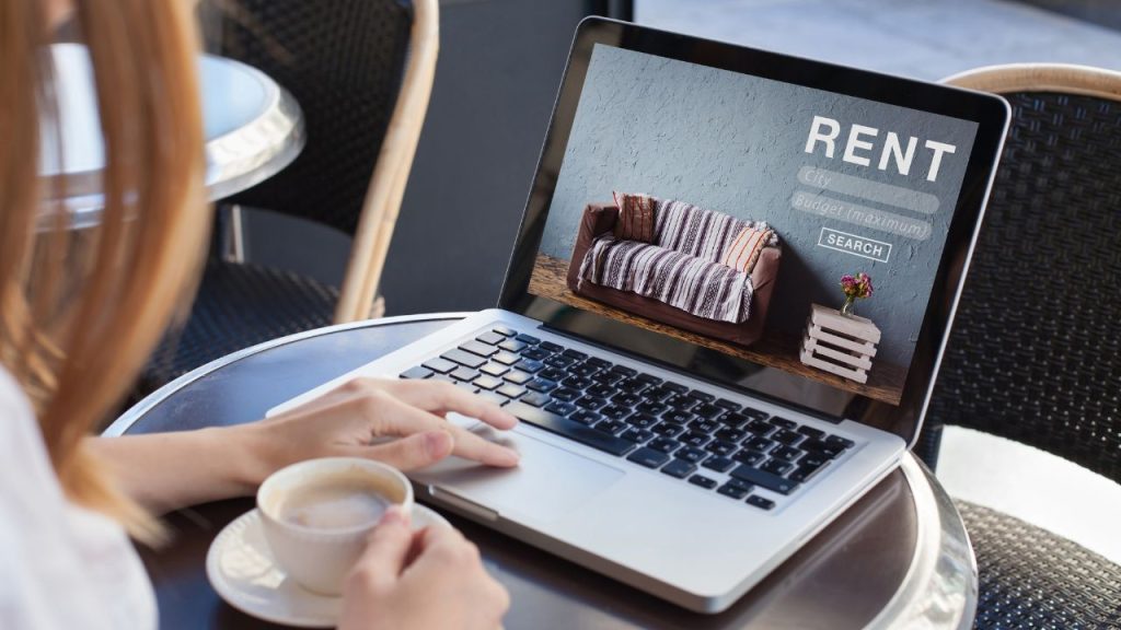 a person looking at rental listing online